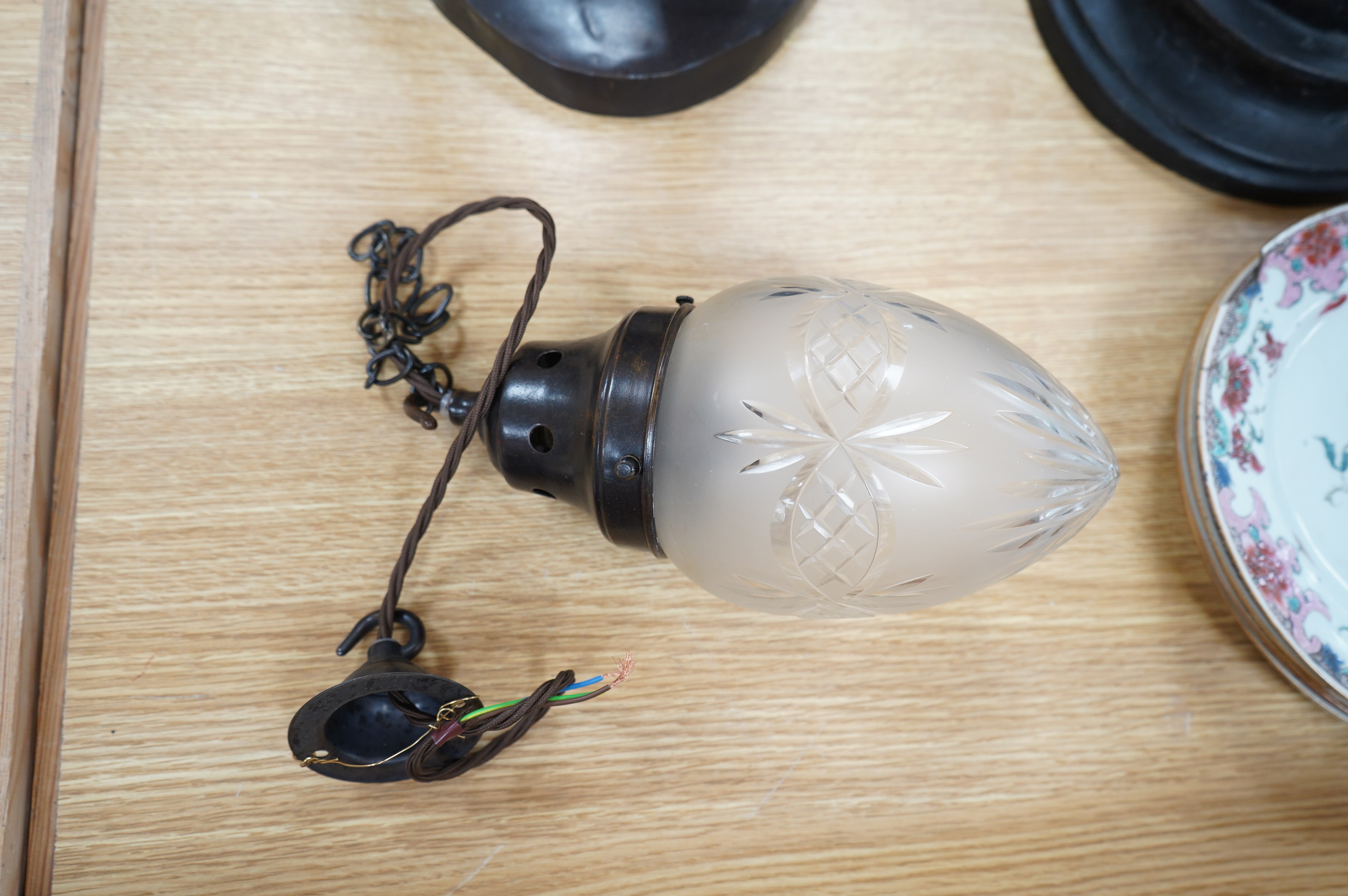 An English 1920’s frosted with clear cut crystal acorn pendant with gilded bronzed fitting, chain and ceiling rose, wired, glass including gallery 25cm high, 12cm across. Condition - good.